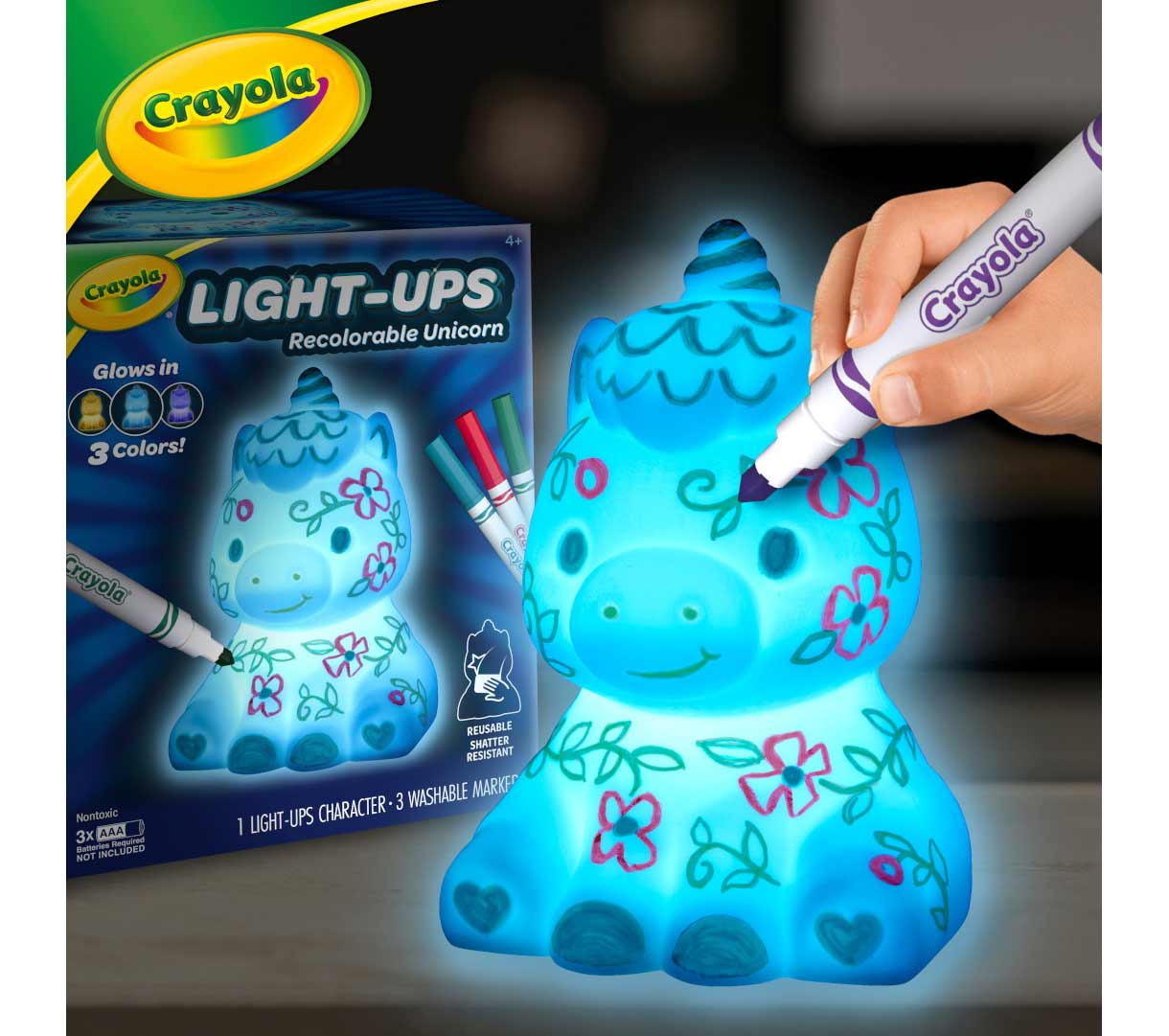 Light-Ups  Unicorn. Unicorn being decorated with washable marker while glowing with packaging in the background.