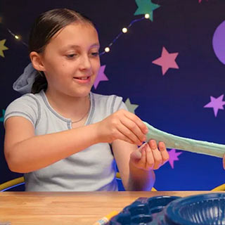 goo-inspiration-4 Young girl pulling Crayola Goo and stretching it