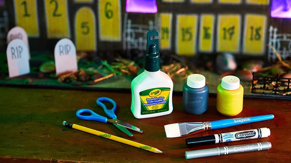 Crayola supplies being used on halloween crafts.